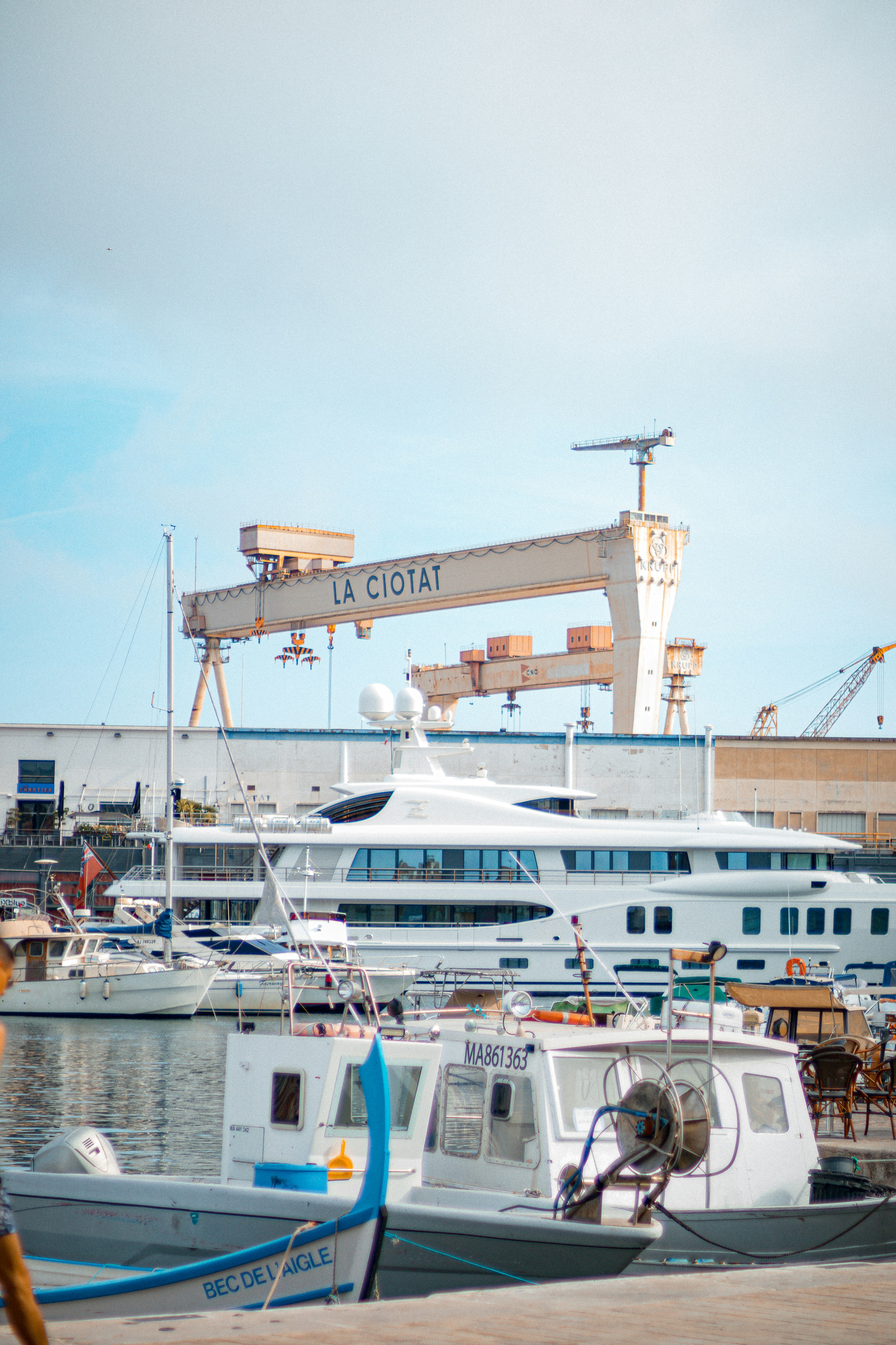 white and blue ship on sea during daytime